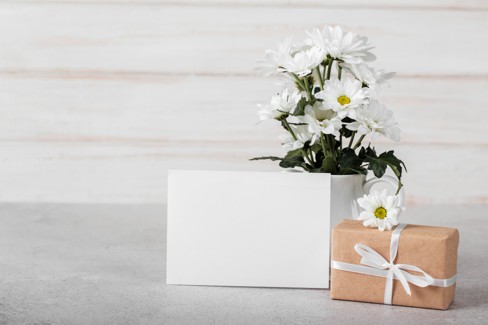 white-flowers-arrangement-with-empty-card